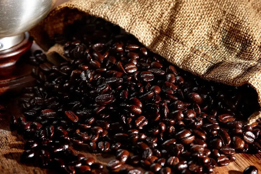 Burlap sack of whole coffee beans