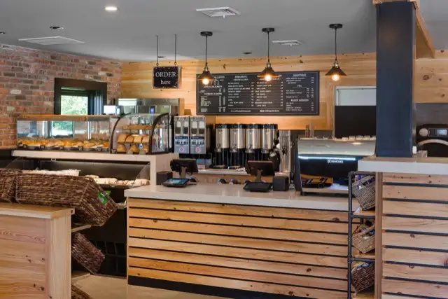 Counter with wood slat front and pendant lights