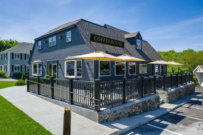 The Old King's Coffeehouse building with patio umbrellas
