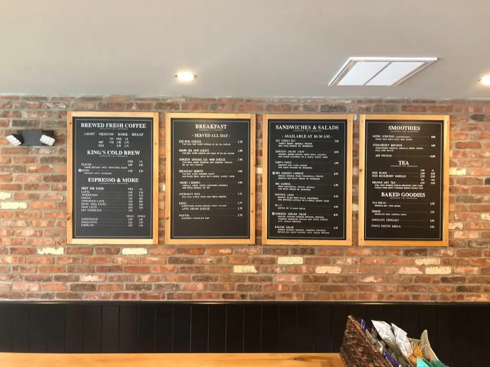 Chalkboard menu boards behind the counter