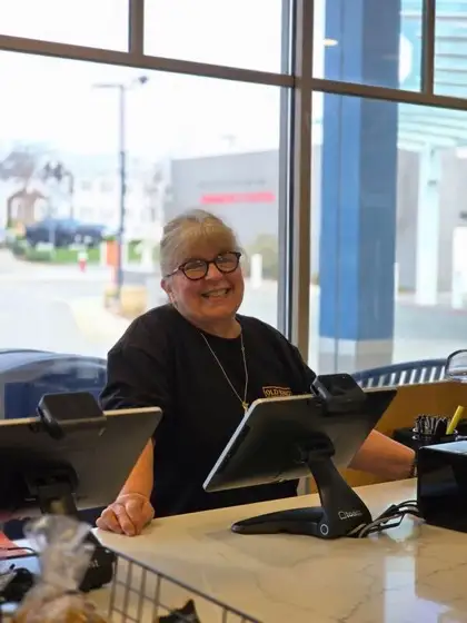 Linda at the register