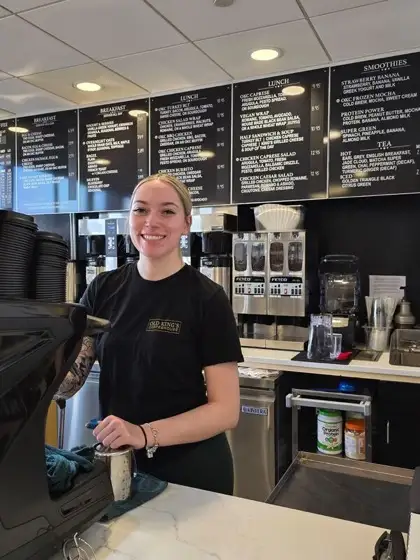 Liv behind the counter
