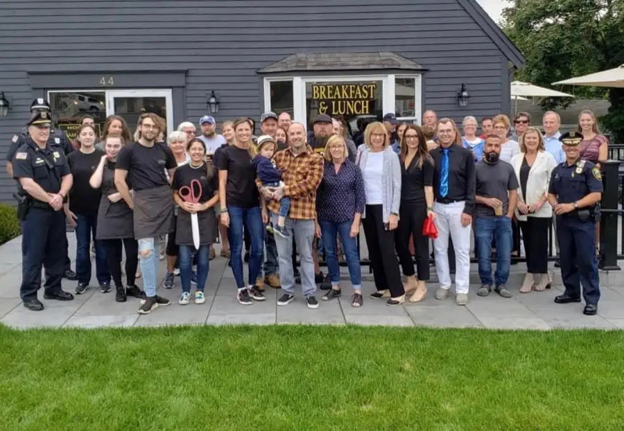The Old King's team and friends gathered in front of the coffeehouse on opening day